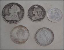 A group of Victorian silver coins to include three Queen Victoria shilling dated 1890, 1896 and