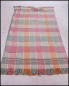 A vintage mid 20th century Welsh ' marriage / love '  blanket of chequered form having tassled ends.