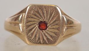 A 9ct gold and ruby hallmarked signet ring. Birmingham hallmarks, makers JH. Total weight 2.7g /