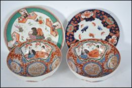 A pair of highly decorated Chinese Famille Rose porcelain ceramic bowls with patterned spheres to