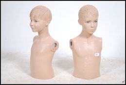 A pair of mid 20th century shop mannequin torso's in the form of children