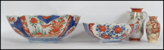A pair of late 19th / early 20th century Chinese Imari pattern ceramic porcelain bowls. Together