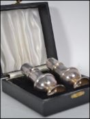 A cased silver hallmarked condiments set complete in the original presentation case. Hallmarked
