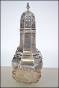 A silver hallmarked Sherry decanter label being hallmarked for Birmingham by Bishtons Ltd dating