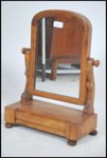 A Victorian mahogany toilet swing mirror - dressing table mirror raised on a plinth base with