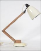 A vintage Maclamp desk/table lamp in good vintage condition with faux wooden arms. Designed by