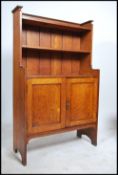 An American H Herrmann Ltd 1904 Edwardian Arts & Crafts oak cabinet. Of upright form, constructed of