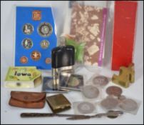 A collection of items to include coins, salt and pepper cruet, hip flask, tortoiseshell pen knife, a