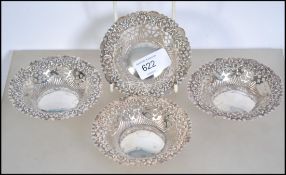 A group of four matching silver hallmarked fret pierced peanut dishes. Assay mark for Chester,