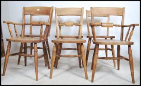A set of 6 Windsor bar back dining chairs raised on turned legs united by stretchers having saddle