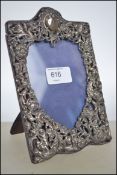 A Victorian silver hallmarked rococo picture frame having an easel back. Hallmarked for William