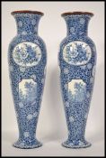 A pair of late 19th / early 20th century Royal Bonn Delft baluster vases in blue and white, each