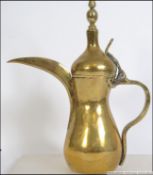 An Islamic turkiks teapot brass Dallah teapot coffee pot having tall thin spout with handle and