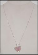 A 9ct / 375 white gold necklace and mother of pearl & diamond heart pendant. Marked 9k / 375.
