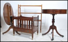 A Regency style mahogany drum table raised on turned tripod supports together with another single