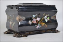 A 19th Century Victorian papier mache tea caddy with original interior, decorated with hand