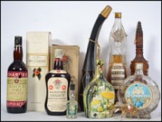 A collection of vintage and retro drinks bottles to include Charves Marquis Port, Mackinlays 12 year