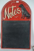 A 20th century painted wall hanging framed blackboard with a Black Labrador incorporated within