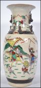 A large late 19th / early 20th century Chinese crackle glaze vase depicting warrior scenes in the