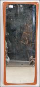 A 20th century retro teak wood framless mirror of oblong form.