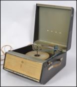 A vintage 20th century two tone portable four speed  record player by Bush