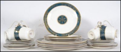 A Royal Doulton part dinner service in the Carlyle pattern, consisting of dinner plates, side plates