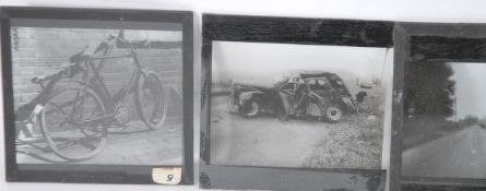 A small collection of magic lantern slides showing images of vehicle crashes to include cars and