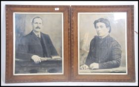 A large pair of vintage early 20th century black and white photographic portrait studies of suited