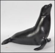 A Royal Dux figure of a seal with pink triangle branded lozenge.  This unusual piece is glazed in