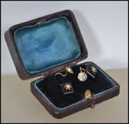 Two pairs of 9ct gold earrings one pair stamped and the other pair tested, one pair being Art Deco