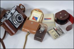 A vintage Zeiss Ikon slr camera complete in the le