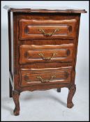 A French 20th century oak pedestal chest of drawers having a bank of drawers with shaped details,