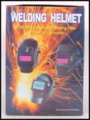 An original boxed Welding Helmet still within its original packaging.