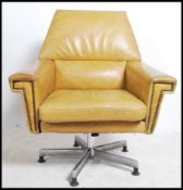 A retro 1960's Mustard leather swivel armchair of