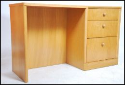 A retro 20th century blond oak writing desk by Mer