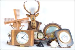 A collection of mid 20th century kitsch items to include a wall mounted deer head barometer, musical