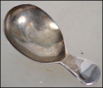 An unusual silver hallmarked caddy spoon of stub f