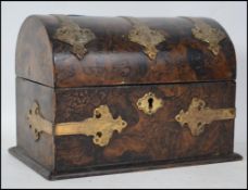 A Victorian burr walnut and gilt metal adorned dom