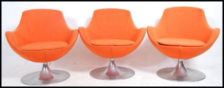 A set of 3 retro 20th century armchairs in the man