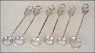 6 silver white metal spoons having filigree worked