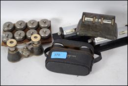 A cased set of opera glasses together with another