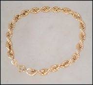 A hallmarked 9ct gold rope twist chain bracelet. Hallmarked import Sheffield. Weight 3.2g.