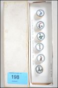 An original set of Guinness waistcoat buttons complete in the original packaging, each with enamel