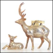 An unusual 20th century brass table lighter in the