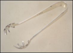 A pair of silver hallmarked sugar tongs with claws
