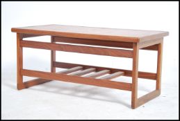A retro 1970's teak tile top coffee table of recta