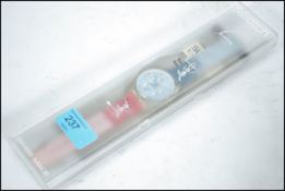 A cased unused collectors Swatch Watch. The face o