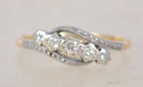 An 18ct gold platinum and diamond 5 stone ring in