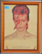 A vintage David Bowie 'Aladdin Sane' framed and glazed print, depicting Bowie in his infamous