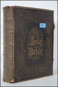A VIctorian brass clasp, leather and gilt tooled bible having chromo-lithography by Henry & Scott,